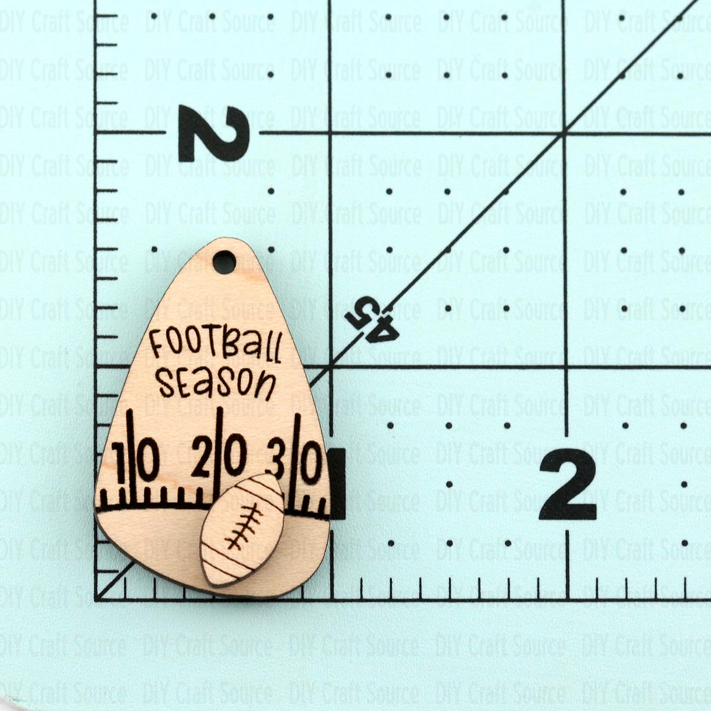 Wooden earring blank with 'Football Season' text that are ready to paint.