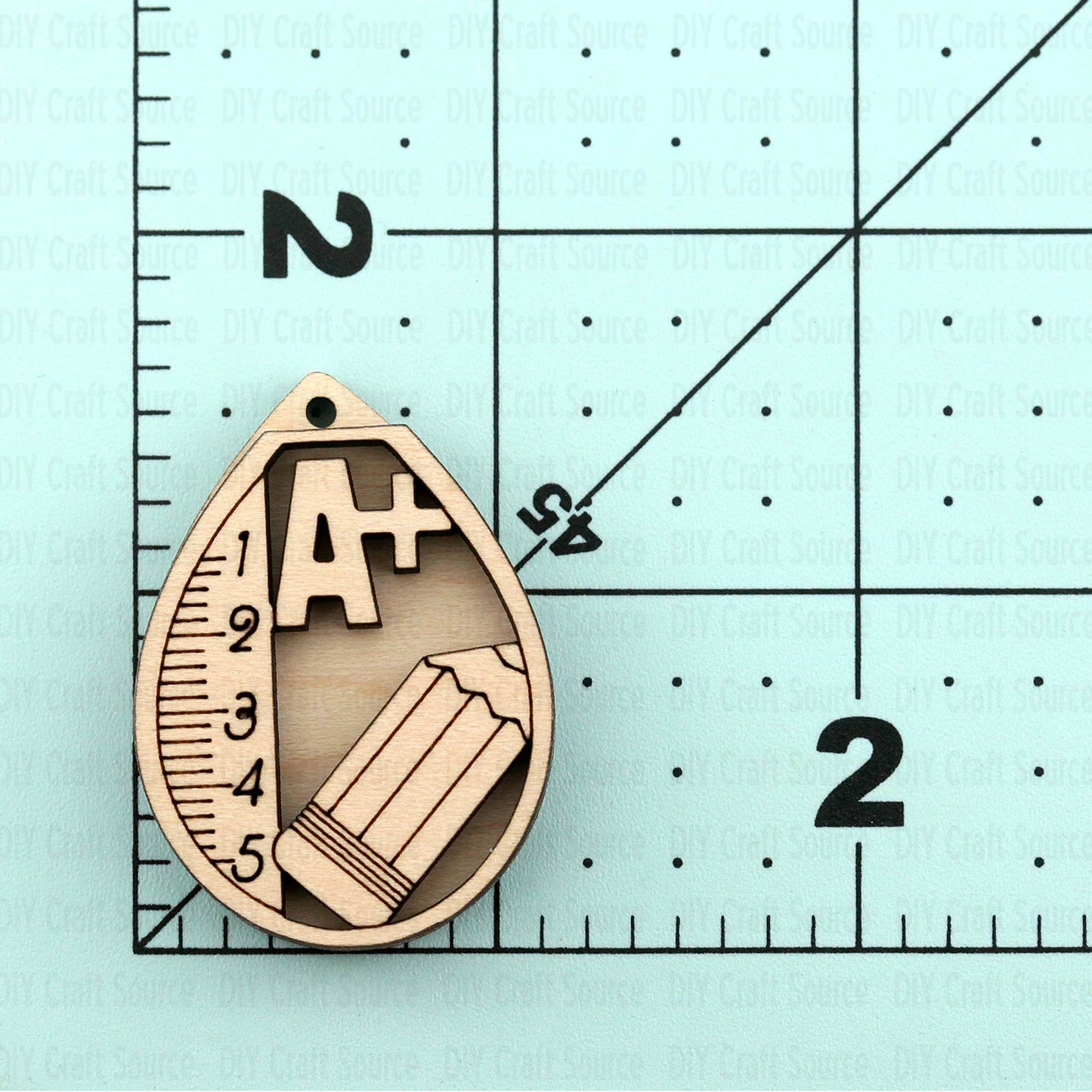 wooden laser blank earrings with teacher design that is ready to paint