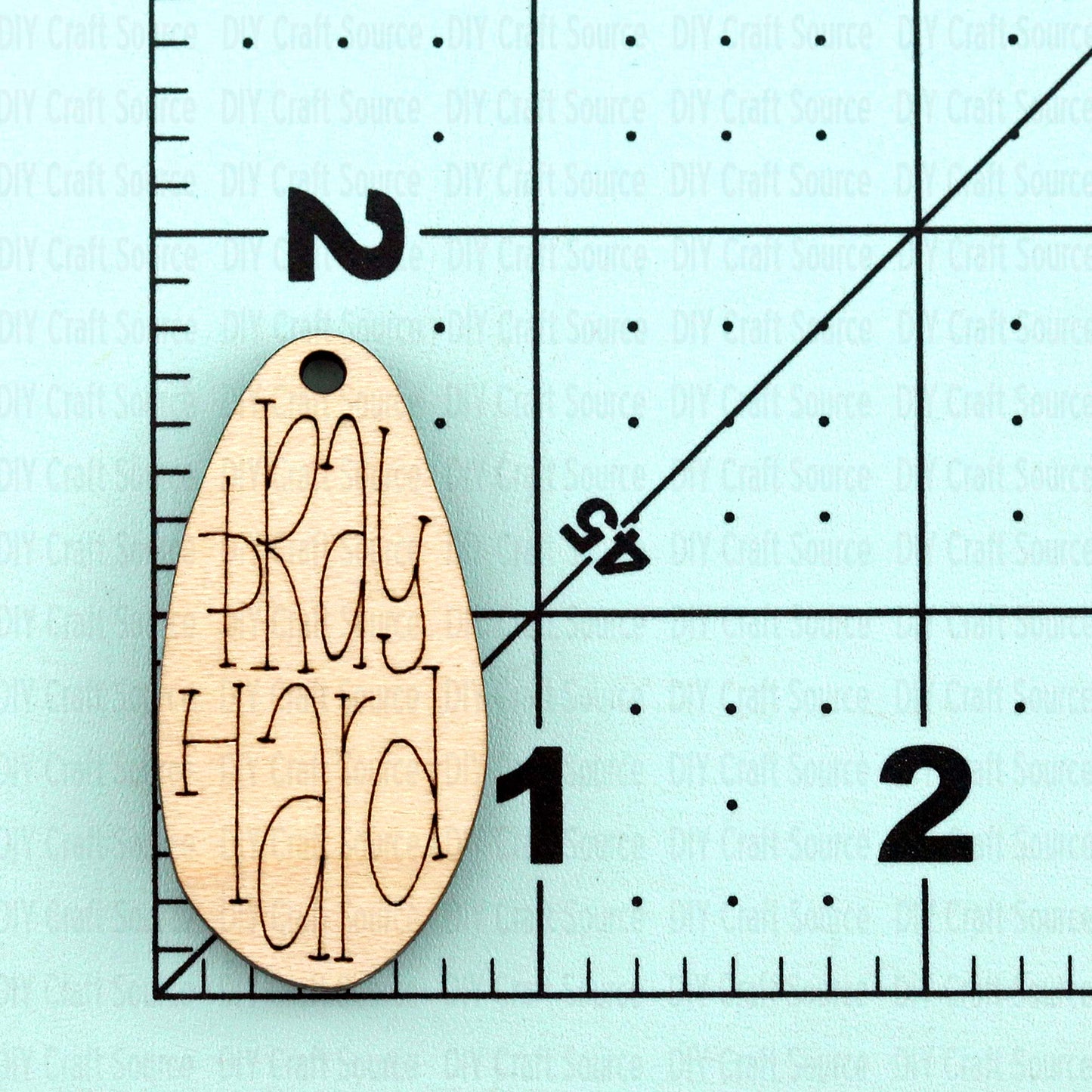 Wood blank with 'Pray Hard' text is ready to paint for earrings