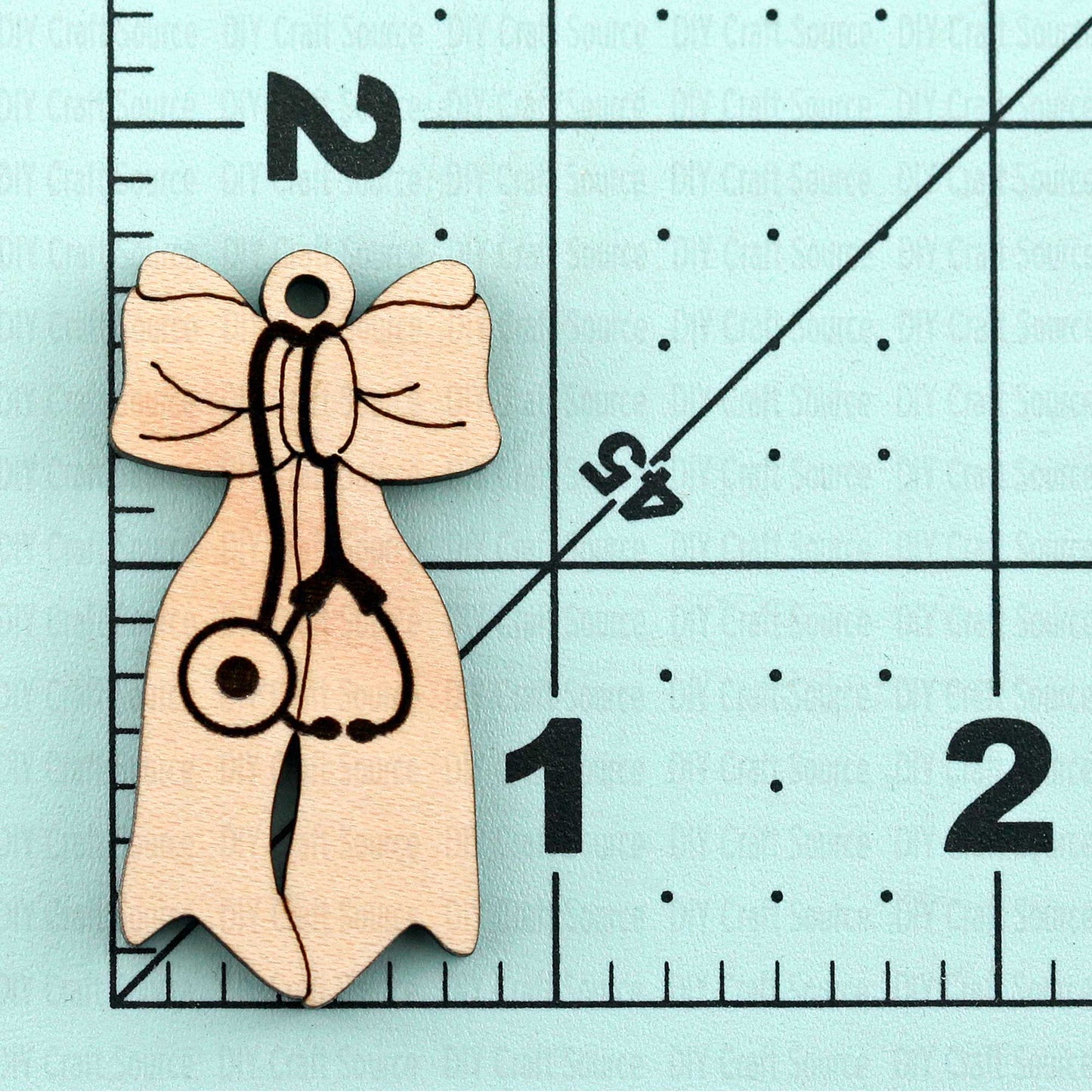 two wooden nurse earrings ready to paint