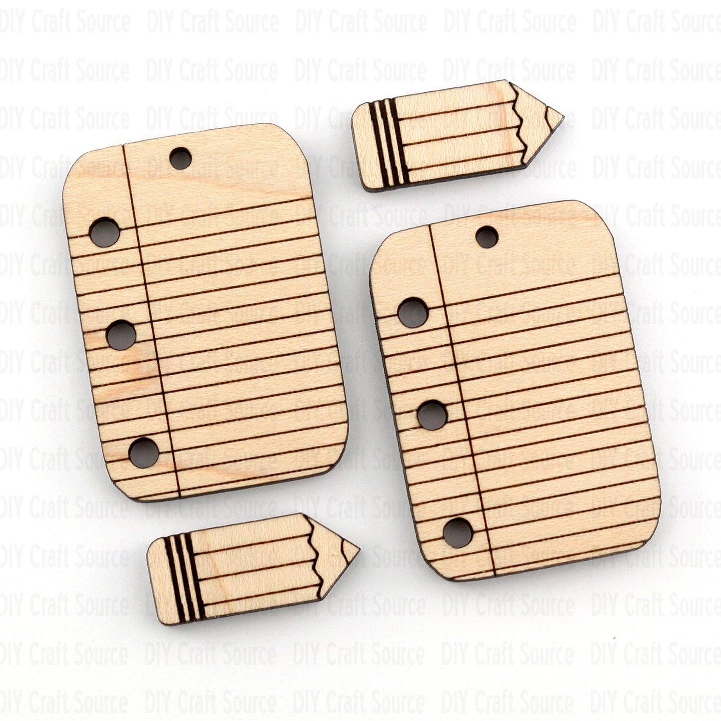 Wooden laser blank earrings shaped like a pencil and a piece of paper with lines on a white background