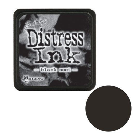 Distress Ink pad by Tim Holtz for black soot color with a black circle showing the ink color on a white background