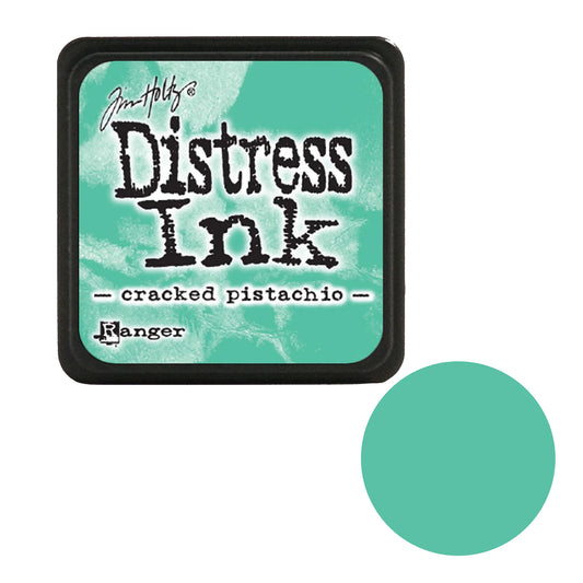 Tim Holtz Distress Ink pad with cracked pistachio color swatch on a white background