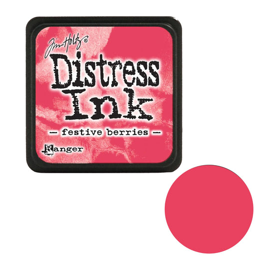 Tim Holtz Distress Ink pad in festive berries color with a pink swatch on a white background