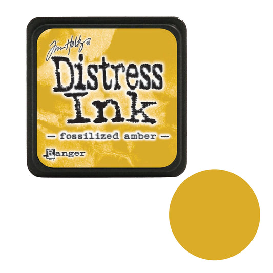 Tim Holtz Distress Ink pad with 'fossilized amber' color swatch on a white background