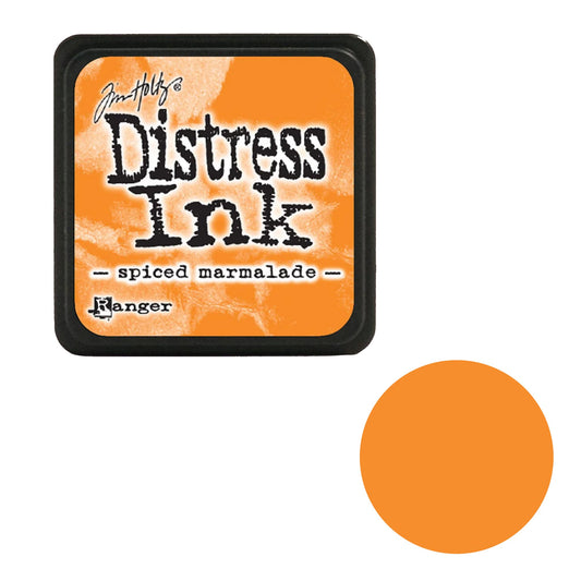 Tim Holtz Distress Ink pad for spiced marmalade color by Ranger on an orange background