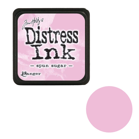Tim Holtz Distress Ink pad with a pink swatch on a white background