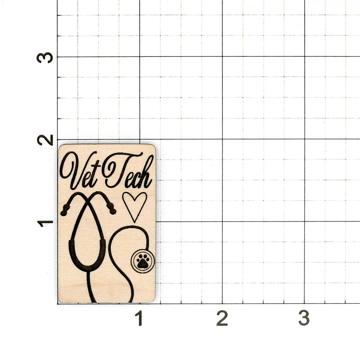 Wooden claw clip blanks with 'Vet Tech' and stethoscope design on a grid 