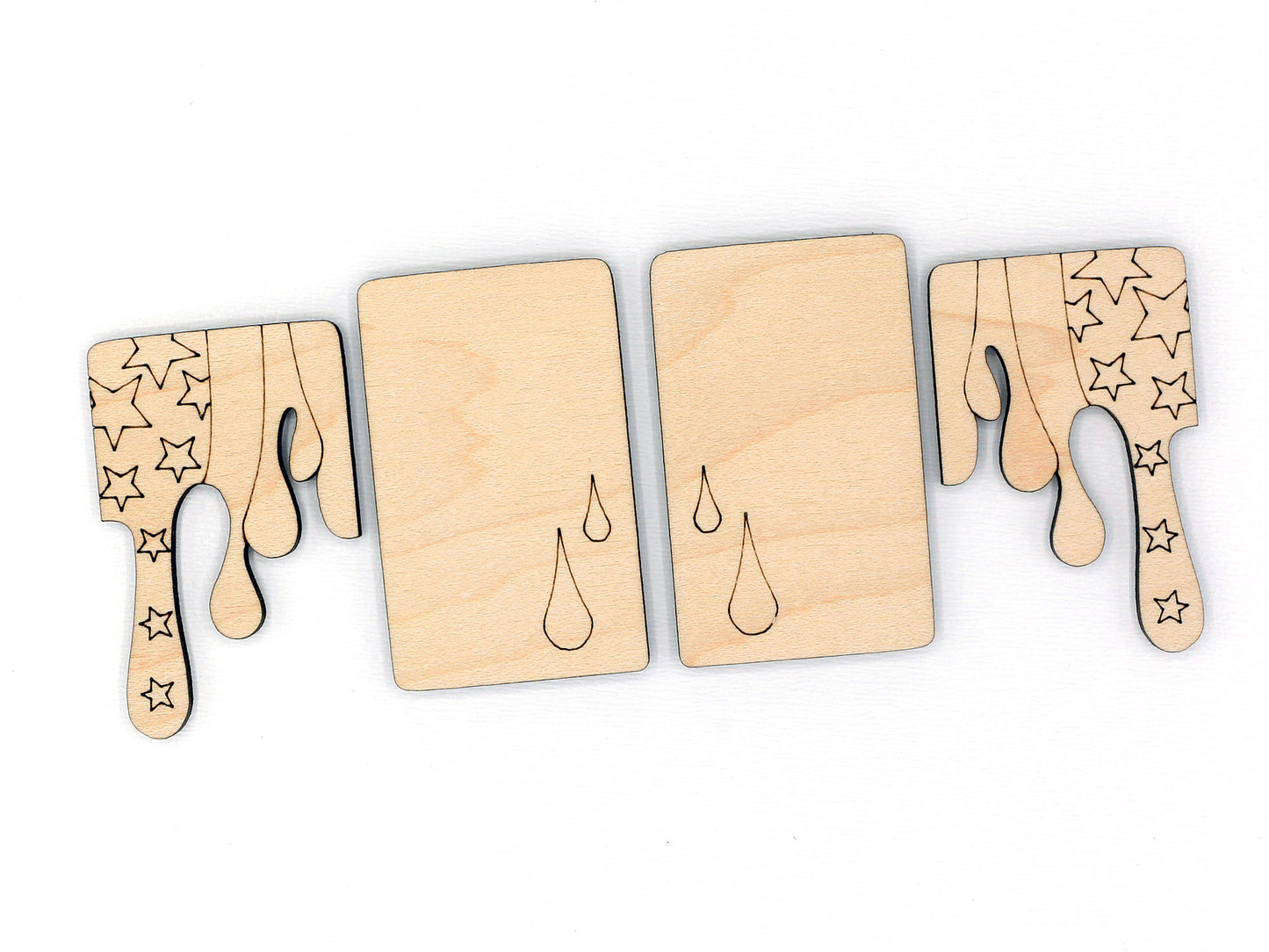 Set of wooden claw clip blanks with star and droplet designs on a white background