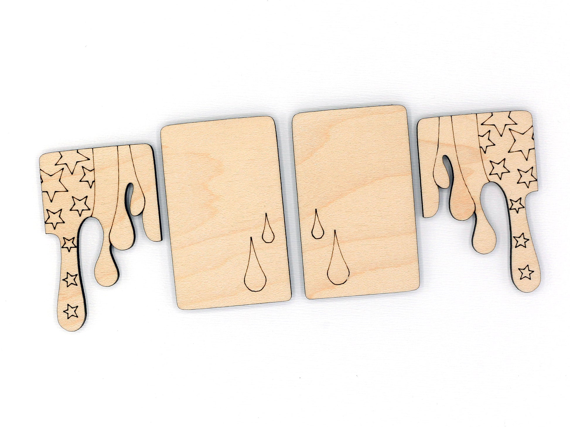 Set of wooden claw clip blanks with star and droplet designs on a white background