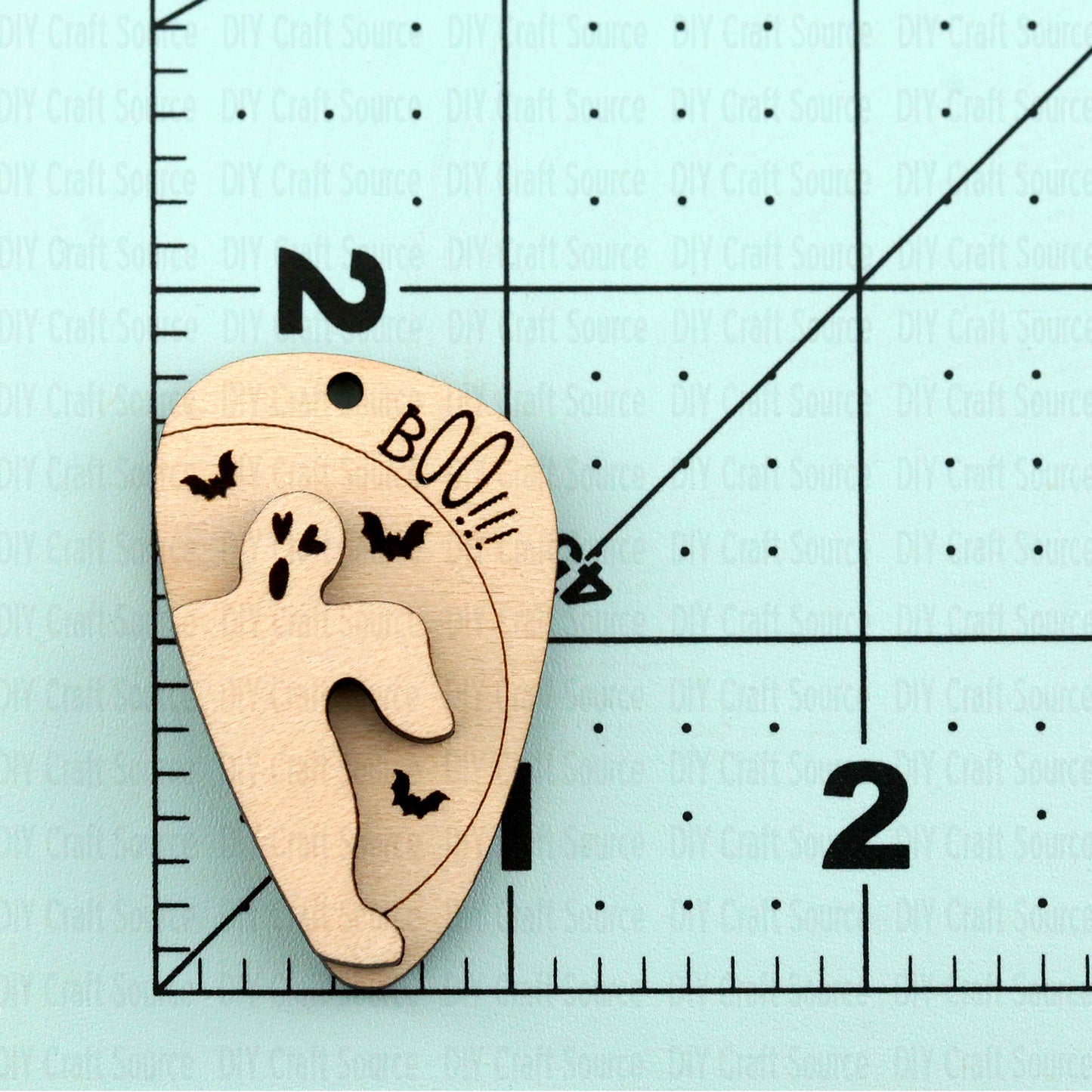 Wooden laser blank earrings of a ghost with bats and 'BOO!!!' that are ready to paint