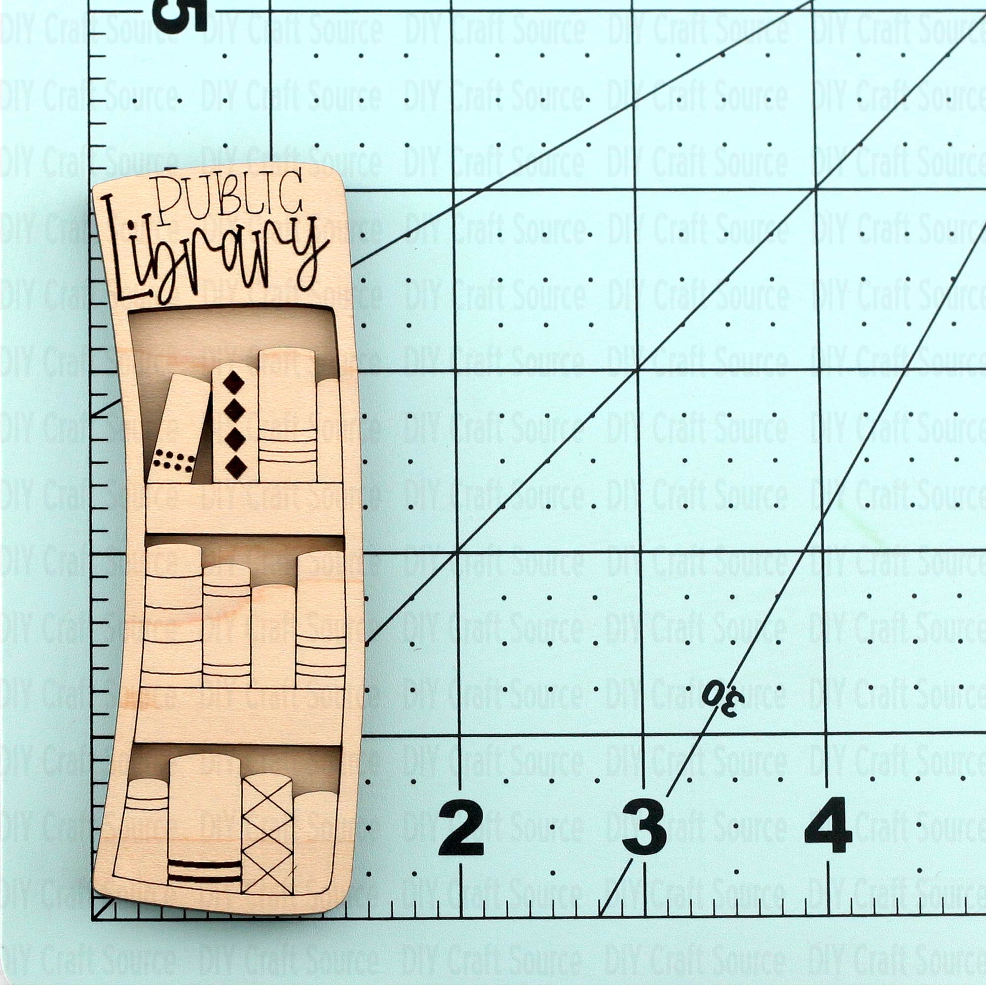 Wooden laser blanks with 'Public Library' design for hair claw clip that is ready to paint