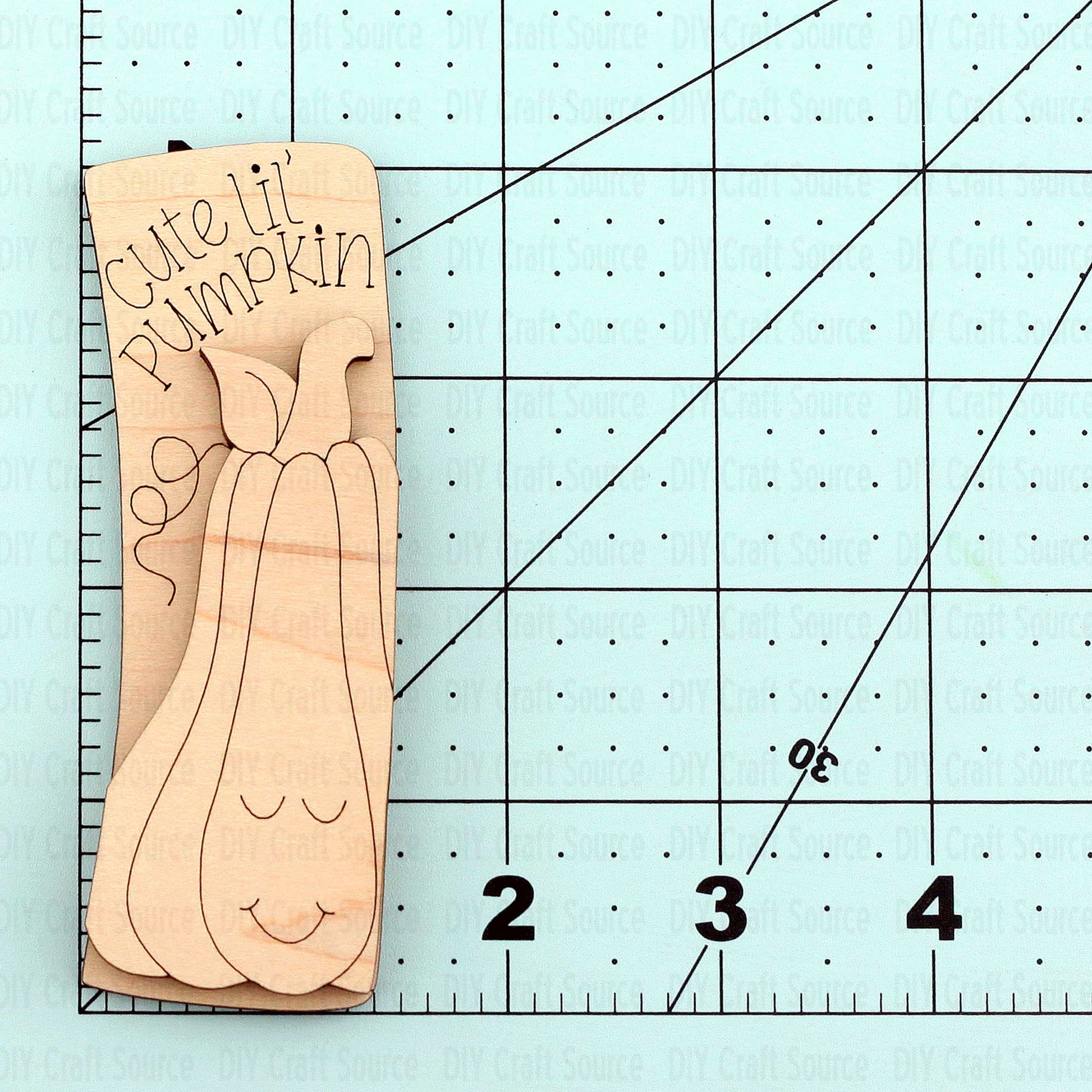 Wooden pumpkin-shaped laser blank with 'Cute Lil Pumpkin' text for a hair clip
