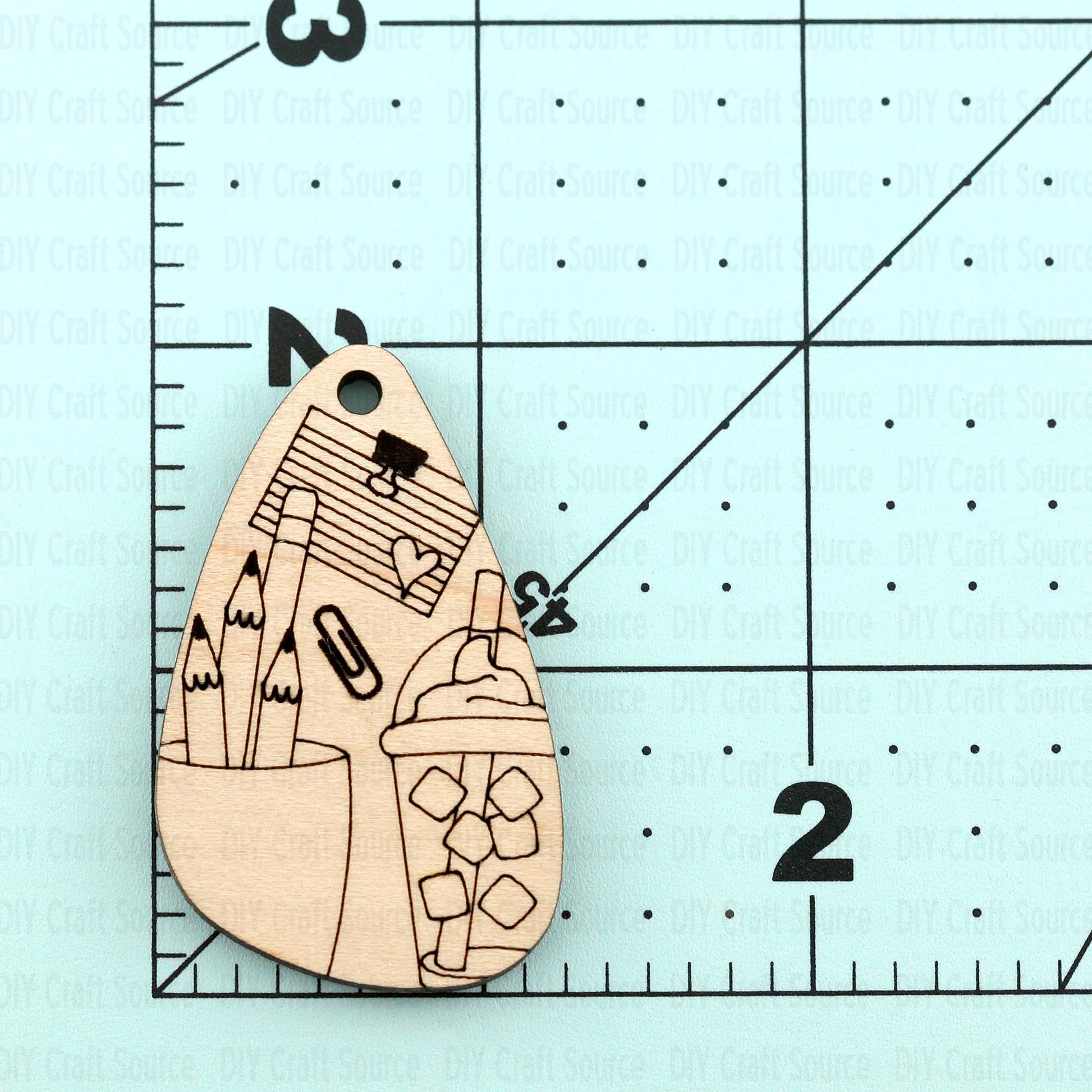 Wooden laser blank earrings with teacher supplies that are ready to paint