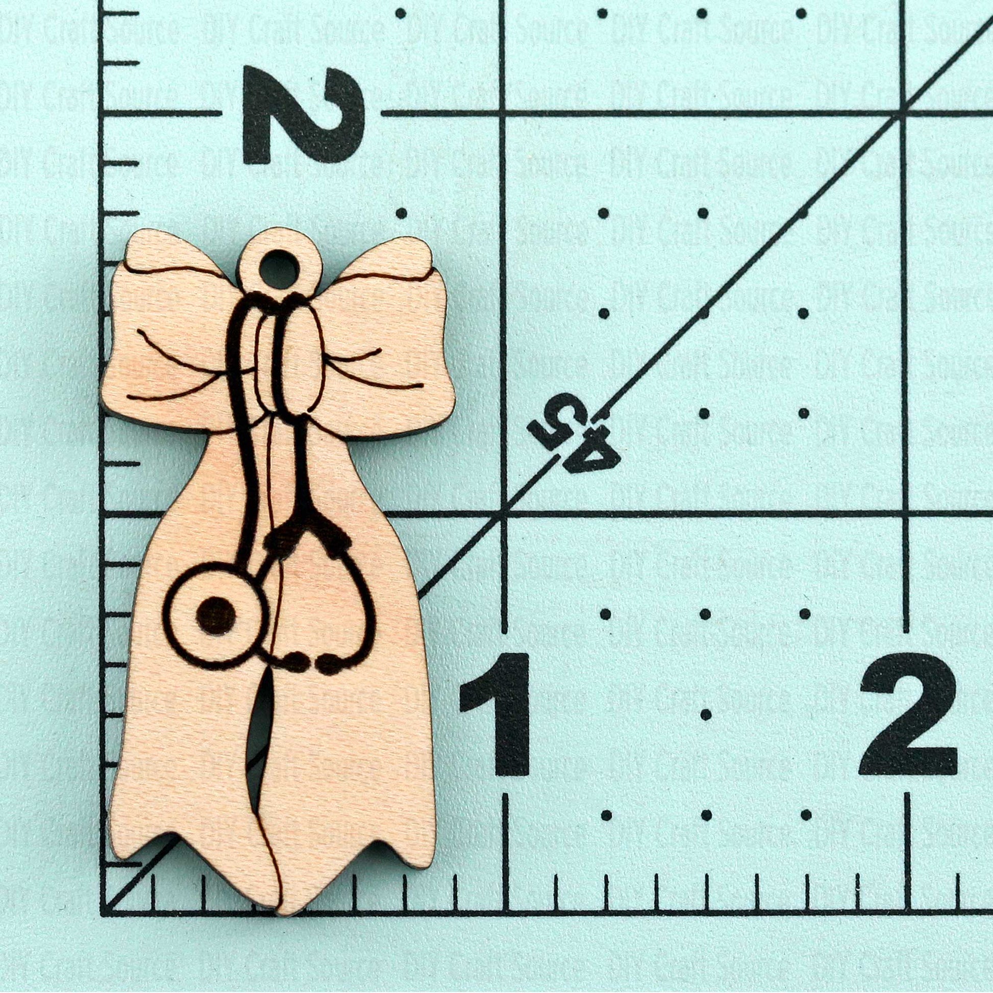 two wooden nurse earrings ready to paint