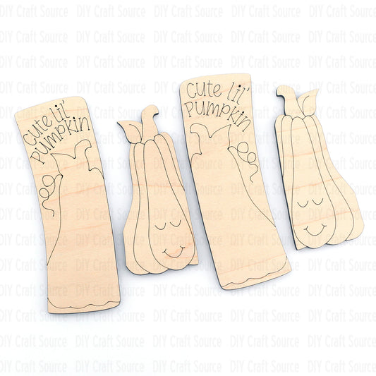 Wooden pumpkin-shaped cutouts with 'cute lil' pumpkin' text on an unfinished laser cut blank for hair clip