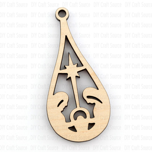 Laser cut wood blank in a teardrop shape with nativity scene for a miniature ornament on a white background.