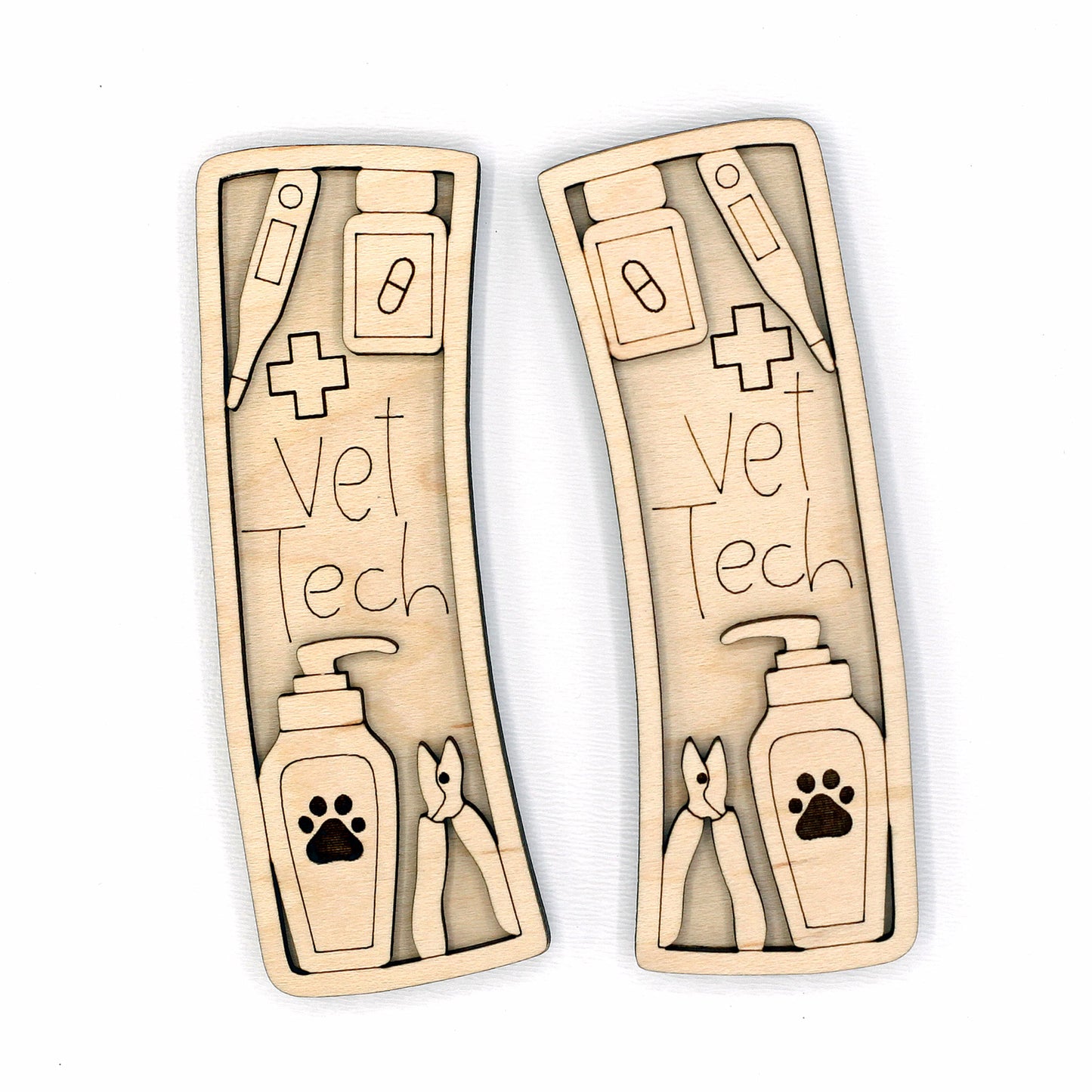 Wooden hair clip pieces with 'Vet Tech' design on a white background