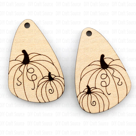 Wooden teardrop-shaped laser blank earrings with pumpkin design on a white background